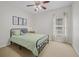 Cozy bedroom features neutral tones, carpet flooring, bright windows, and a ceiling fan at 124 Corral Cir, Summerville, SC 29485