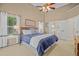 Inviting bedroom with large windows, bedside tables, and a view of the attached bathroom at 124 Corral Cir, Summerville, SC 29485
