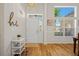 Bright foyer with hardwood floors, a stylish console table, and a welcoming, airy atmosphere at 124 Corral Cir, Summerville, SC 29485