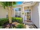 Charming front door with manicured landscaping, a hanging flower basket, and a welcoming ambiance at 124 Corral Cir, Summerville, SC 29485
