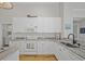 Modern kitchen featuring white cabinetry, granite countertops, and stainless steel appliances at 124 Corral Cir, Summerville, SC 29485