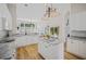 Open kitchen with an island featuring stainless appliances, granite countertops, and wood floors at 124 Corral Cir, Summerville, SC 29485