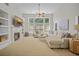 Cozy living room with a fireplace, built-in shelves, large windows, and a comfortable sectional sofa at 124 Corral Cir, Summerville, SC 29485