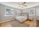 Bedroom with hardwood floors, ceiling fan, and sun-lit windows at 13 Charlestowne Rd Rd, Charleston, SC 29407