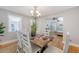Bright dining room featuring modern decor, hardwood floors and seamless access to the living room at 13 Charlestowne Rd Rd, Charleston, SC 29407