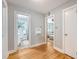 Hallway featuring hardwood floors and entryways to the bathroom and living room at 13 Charlestowne Rd Rd, Charleston, SC 29407