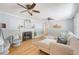 Bright living room with hardwood floors, a fireplace, and comfortable seating and decor at 13 Charlestowne Rd Rd, Charleston, SC 29407