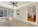 Inviting sunroom with tile flooring, large windows, and brick accent wall at 13 Charlestowne Rd Rd, Charleston, SC 29407