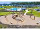 Community aerial view of a playground featuring a pirate ship structure, swing sets, and a slide at 131 Beargrass Ln, Summerville, SC 29486