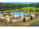Aerial view of community pool area and lounging surrounded by lush landscaping and green lawns at 131 Beargrass Ln, Summerville, SC 29486
