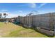 Fenced backyard with a playset, garden beds and a play structure at 131 Beargrass Ln, Summerville, SC 29486