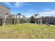 Fenced backyard with a swing set and a playhouse at 131 Beargrass Ln, Summerville, SC 29486