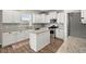 Modern kitchen featuring white cabinets, granite countertops, and stainless steel appliances at 131 Beargrass Ln, Summerville, SC 29486
