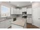 Modern kitchen featuring white cabinets, granite countertops, and stainless steel appliances at 131 Beargrass Ln, Summerville, SC 29486