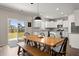 Bright eat-in kitchen with white cabinets, stainless steel appliances, and backyard views at 131 Beargrass Ln, Summerville, SC 29486