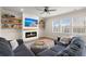 Inviting living room featuring a modern fireplace, built-in shelving, a large TV, and comfortable seating at 131 Beargrass Ln, Summerville, SC 29486