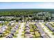 A picturesque aerial view showcasing a well-planned community with lush greenery and modern homes at 1311 Berry Grove Dr, Summerville, SC 29485