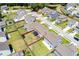 A vibrant aerial shot of a residential area, highlighting backyard spaces, fences, and neighborhood layout at 1311 Berry Grove Dr, Summerville, SC 29485