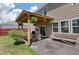 Inviting covered patio with outdoor seating, grill, and views of the fenced backyard at 1311 Berry Grove Dr, Summerville, SC 29485