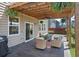 Relaxing covered patio with comfortable seating and a grill for outdoor enjoyment at 1311 Berry Grove Dr, Summerville, SC 29485