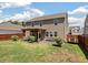 Large backyard with a covered patio area, green lawn, and wood fence at 1311 Berry Grove Dr, Summerville, SC 29485