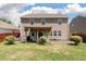 Spacious backyard with lush grass, a cozy patio, and privacy fencing at 1311 Berry Grove Dr, Summerville, SC 29485