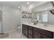 Bright bathroom featuring a double vanity with a large mirror, and white countertop at 1311 Berry Grove Dr, Summerville, SC 29485