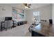 Bright bedroom with a large ocean art piece and a desk area near a window at 1311 Berry Grove Dr, Summerville, SC 29485