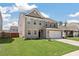 Attractive home with a manicured lawn and a two-car garage on a sunny day at 1311 Berry Grove Dr, Summerville, SC 29485