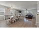 Open-concept living room and dining area with hardwood floors and plenty of natural light at 1311 Berry Grove Dr, Summerville, SC 29485