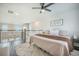 Comfortable bedroom with ceiling fan, railing view and soft natural light from windows at 134 Lucca Dr, Summerville, SC 29486