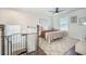 Cozy bedroom featuring plush rug, ceiling fan, and natural light from the window at 134 Lucca Dr, Summerville, SC 29486