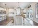 Dining room features a wooden table, modern lighting and white walls with wood laminate flooring at 134 Lucca Dr, Summerville, SC 29486