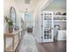 Elegant foyer with hardwood floors, decor and a view into the living room and office space at 134 Lucca Dr, Summerville, SC 29486