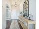 Well-lit foyer featuring a console table, decorative mirror, and stylish rug for a welcoming first impression at 134 Lucca Dr, Summerville, SC 29486