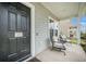 Inviting front porch with comfortable seating area that enhances the curb appeal of this cozy home at 134 Lucca Dr, Summerville, SC 29486