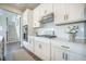 Updated kitchen features white cabinets and stainless steel appliances at 134 Lucca Dr, Summerville, SC 29486