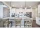 Bright kitchen features a large island, pendant lights, stainless appliances, and white cabinets at 134 Lucca Dr, Summerville, SC 29486