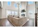 Grand living room with soaring ceilings, large windows, fireplace and an open layout perfect for entertaining at 134 Lucca Dr, Summerville, SC 29486