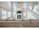 Living room with fireplace, television, grand staircase and elegant chandelier at 134 Lucca Dr, Summerville, SC 29486