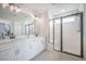 Bright main bathroom with double vanity sinks and large glass-enclosed shower at 134 Lucca Dr, Summerville, SC 29486
