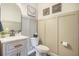 Charming powder room with decorative wall panels, stylish vanity, and elegant mirror at 134 Lucca Dr, Summerville, SC 29486