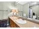 Neutral bathroom with a large vanity, sink, and a view of the shower at 1404 Palmetto Blvd, Edisto Beach, SC 29438