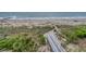 Beach access via boardwalk through dunes with coastal vegetation at 1404 Palmetto Blvd, Edisto Beach, SC 29438