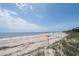 Picturesque ocean view of a serene beach with calm waves and white sand at 1404 Palmetto Blvd, Edisto Beach, SC 29438
