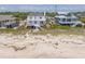 Beachfront homes with balconies offer stunning views of the ocean at 1404 Palmetto Blvd, Edisto Beach, SC 29438