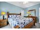 Light and airy bedroom with hardwood furnishings, soft colors and natural lighting at 1404 Palmetto Blvd, Edisto Beach, SC 29438