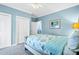Comfortable bedroom with soft lighting, featuring white trim and ample closet space at 1404 Palmetto Blvd, Edisto Beach, SC 29438
