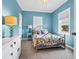 Charming bedroom with a decorative bed frame and bright bedding at 1404 Palmetto Blvd, Edisto Beach, SC 29438