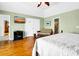 Bedroom features hardwood floors, ceiling fan, and access to an en suite bathroom at 1404 Palmetto Blvd, Edisto Beach, SC 29438